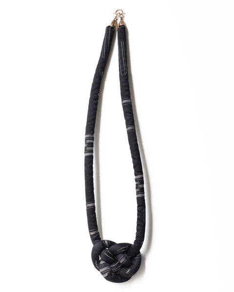 handmade knotted necklace with brass closure. Black and white ikat silk from a vintage kimono.