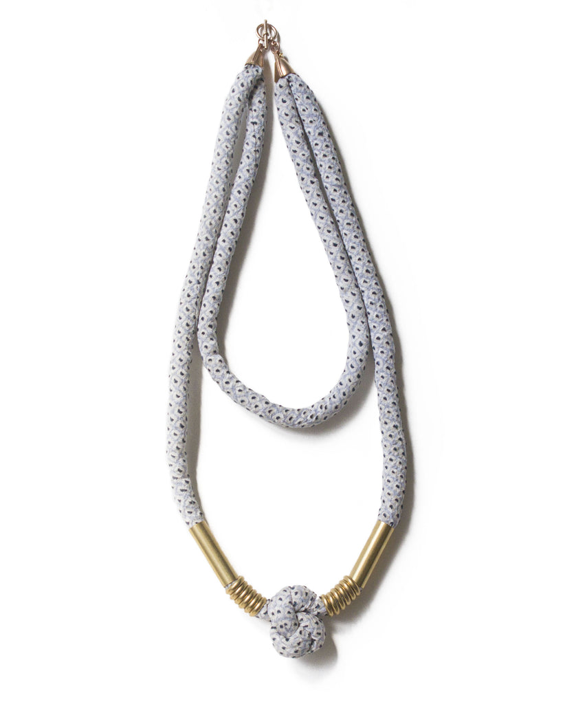 handmade double layer knotted necklace with brass closure and beads. light blue and white shibori dot silk from a vintage kimono.
