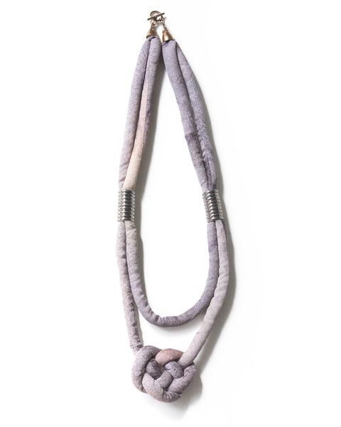 handmade multi strand knotted pendant necklace with silver color beads and brass closure. multi color pastel purple and pink ombre silk. jacquard texture