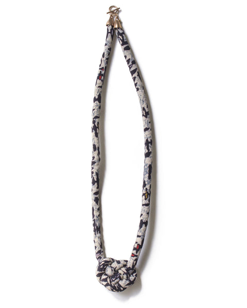 handmade single carrick knotted necklace with brass closure. abstract multi color print silk from a vintage kimono. black and white cream