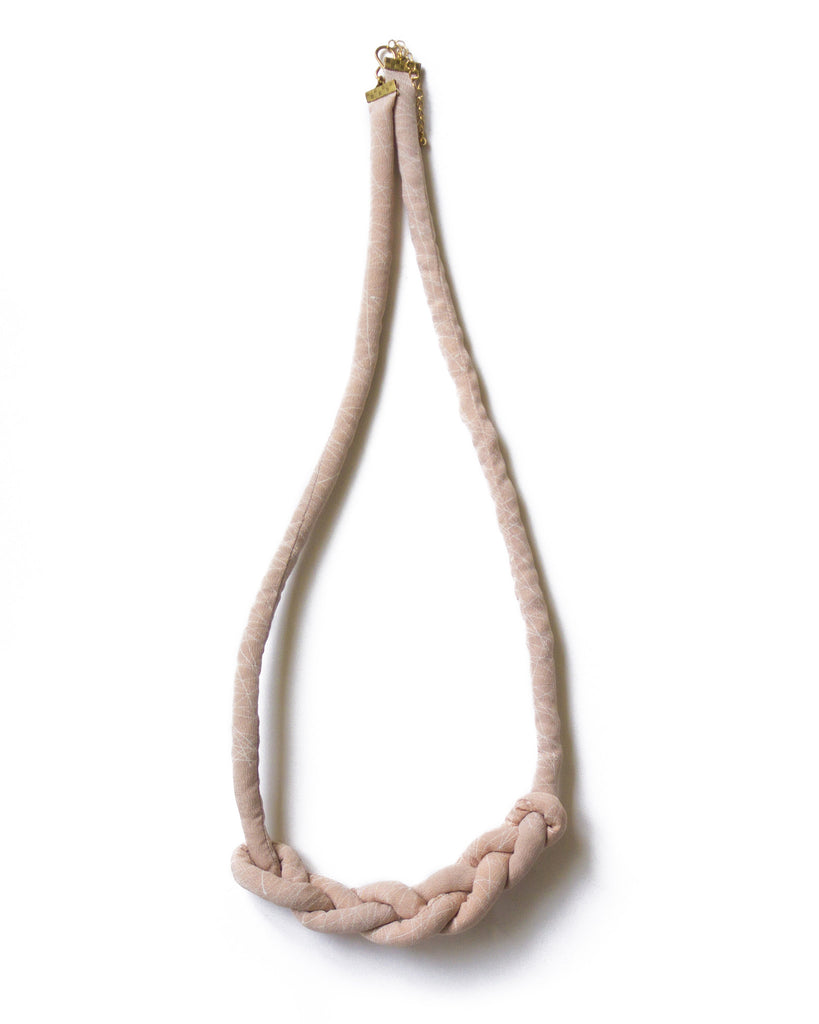 handmade braid knotted necklace with brass closure. multi color light baby pink and white geometric triangle print silk from a vintage kimono.