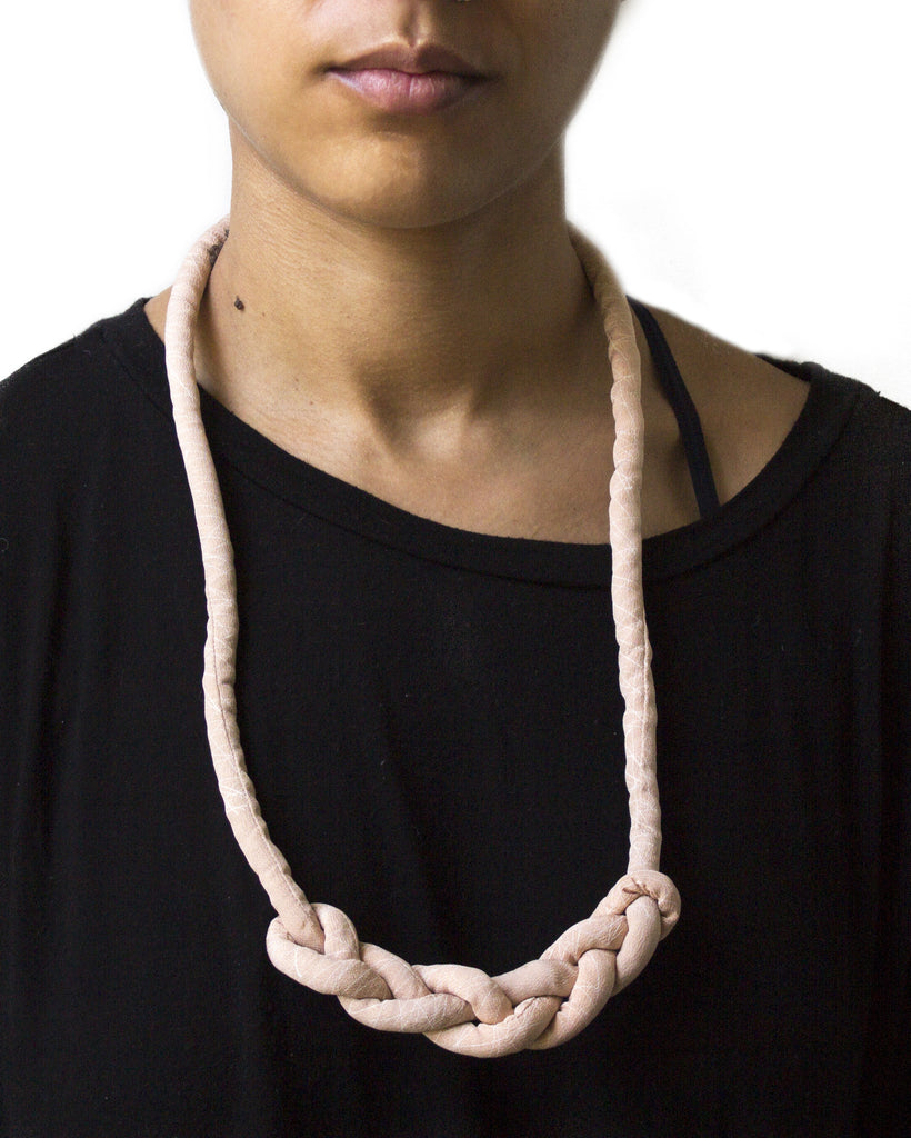 handmade braid knotted necklace with brass closure. multi color light baby pink and white geometric triangle print silk from a vintage kimono.